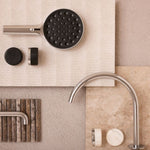 Nero Serenity brushed nickel arc spout and Carrara handle tap set with black and white finish samples