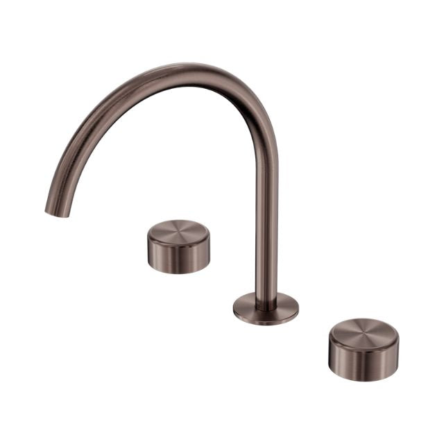 Nero Serenity brushed bronze 3-piece tap set with arc spout and metal handles on white background