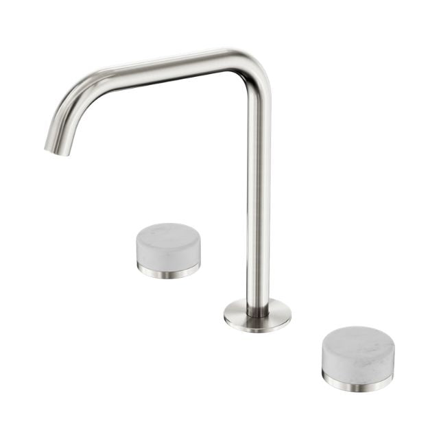 Nero Serenity bath/kitchen set in brushed nickel, with edge spout and two Carrara marble handles on white background