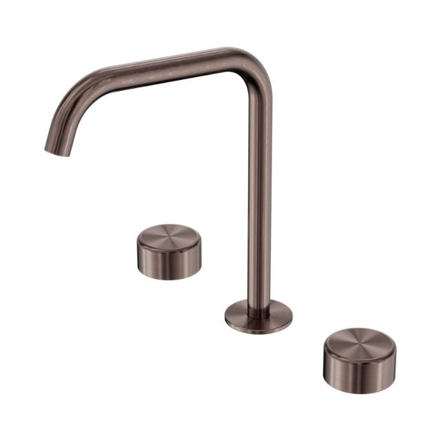 Nero Serenity brushed bronze wall bath/kitchen tap set with edge spout and two metal handles, shown on white background
