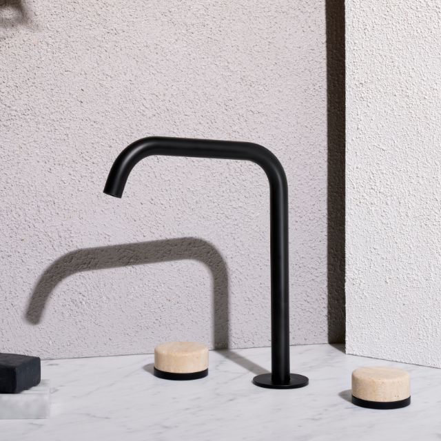 Nero Serenity matte black bath/kitchen set with edge spout and travertine handle on marble surface