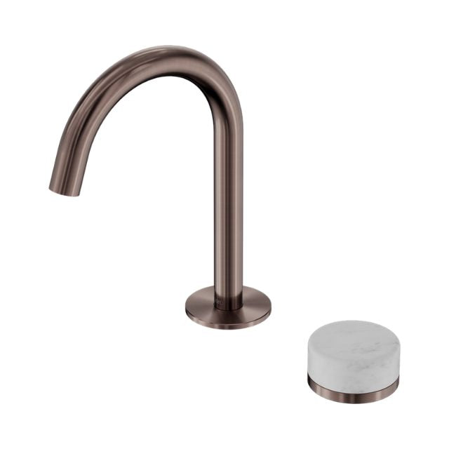 Nero Serenity basin mixer in brushed bronze with arc spout and round Carrara marble handle, isolated on white
