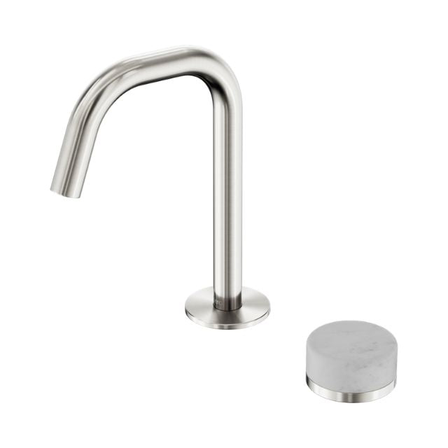 Nero Serenity progressive basin mixer in brushed nickel with curved edge spout and Carrara marble handle, shown on white background