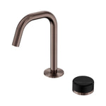 Nero Serenity basin mixer with brushed bronze edge spout and black marble handle, isolated on white
