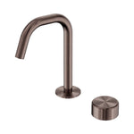 Nero Serenity progressive basin mixer in brushed bronze with curved edge spout and separate metal handle, isolated on white