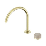 Nero Serenity progressive mixer tap in brushed gold with arc spout and travertine handle, shown on white background with handle separate
