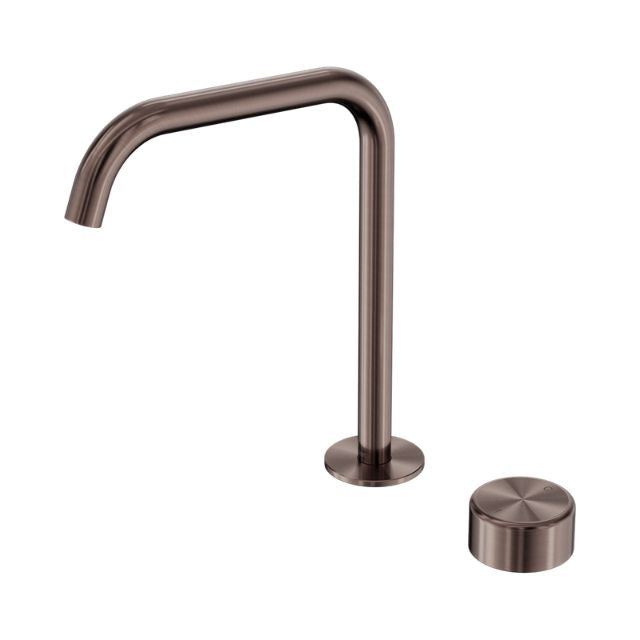 Nero Serenity progressive mixer tap with edge spout and metal handle, brushed bronze, shown on white background with separate handle cap