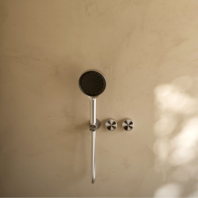 Nero Serenity brushed nickel progressive shower system with metal handle and hand shower, wall mounted with round shower head and controls