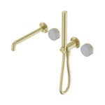 Nero Serenity progressive shower system with spout and slim shower in brushed gold with Carrara marble handles, front view