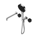 Nero Serenity shower system in chrome with black round handles, bath spout and handheld shower on white background