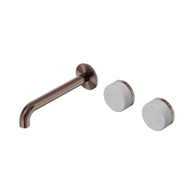 Nero Serenity wall basin set in brushed bronze with offset spout and two Carrara marble handles on white background