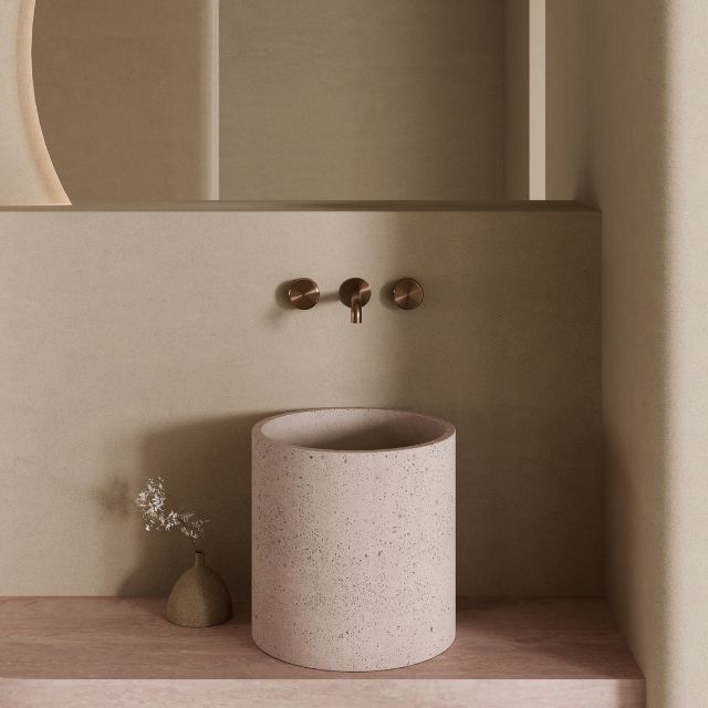 Nero Serenity wall basin set in brushed bronze with 160mm spout and metal handles above a round basin, bathroom setting