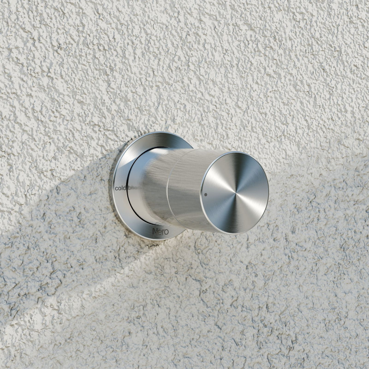Nero Pure brushed nickel shower mixer on textured wall, with round wall plate and cylindrical progressive handle
