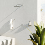 Nero Pure brushed nickel shower mixer set on wall with round shower rose in a modern outdoor bathroom scene