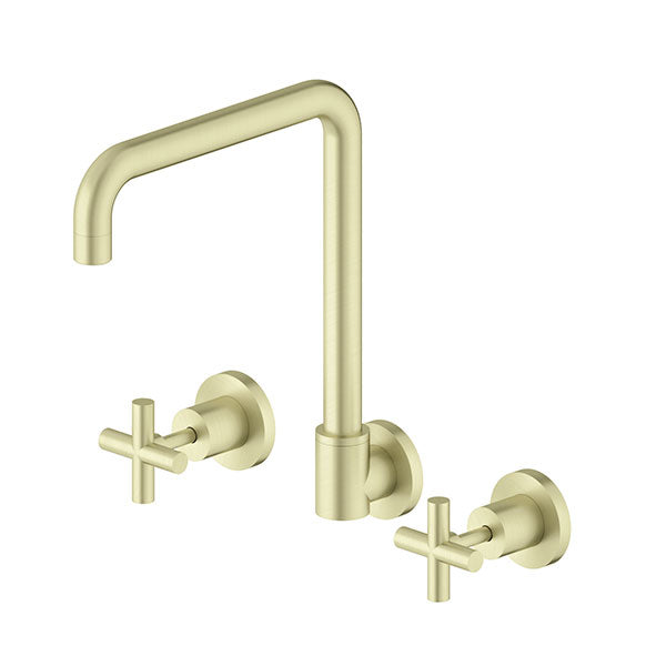 Nero X Plus wall kitchen set in brushed gold, with swivel spout and cross handles, shown on white background