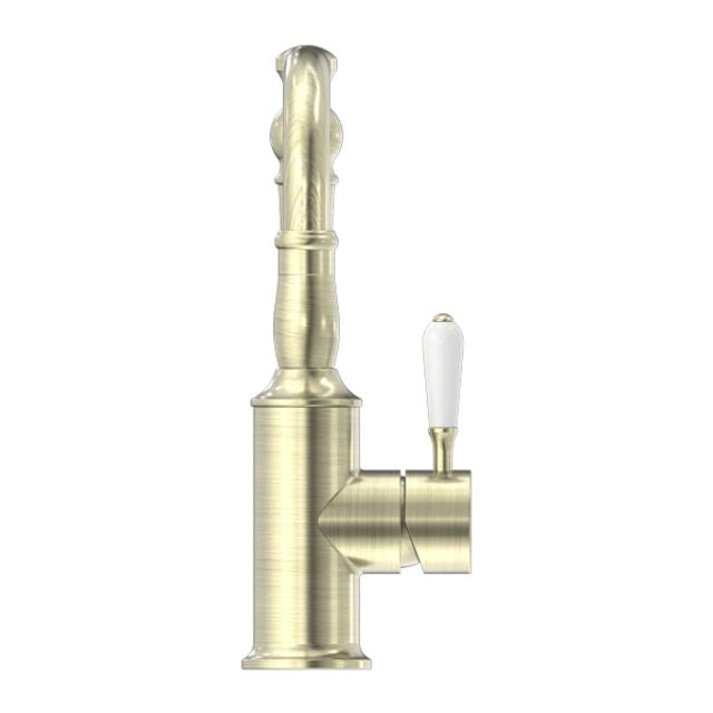 Nero York aged brass basin mixer tap with hook spout and white porcelain lever, side view on white background