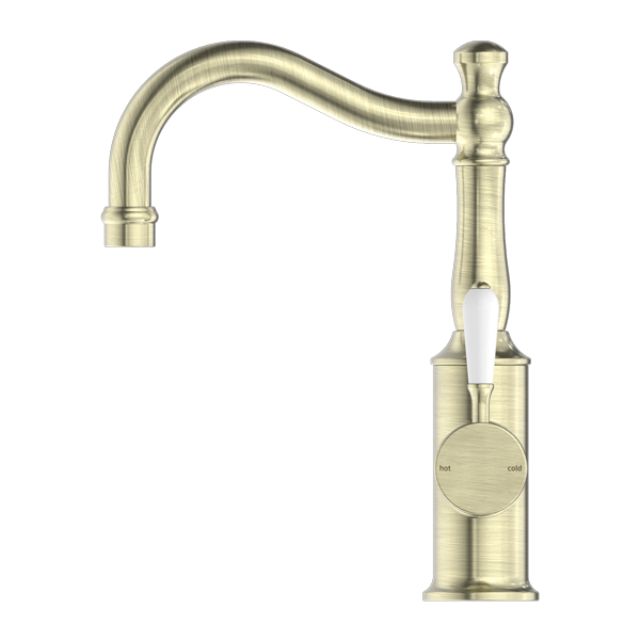 Nero York aged brass basin mixer with hook spout and white porcelain lever, front view on white background