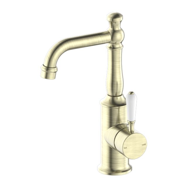Nero York basin mixer tap in aged brass with white porcelain lever, hob mounted, classic curved spout