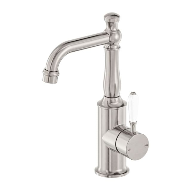 Nero York basin mixer tap in brushed nickel with white porcelain lever, shown on white background