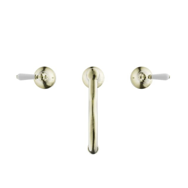 Nero York three-piece basin set in aged brass with white porcelain lever handles, front view on white background