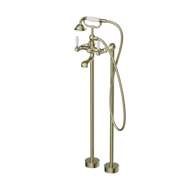 Nero York freestanding bath set in aged brass with white porcelain hand shower and floor-mounted bath filler, front view