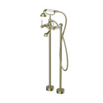 Nero York freestanding bath set in aged brass with white porcelain hand shower and floor-mounted bath filler, front view