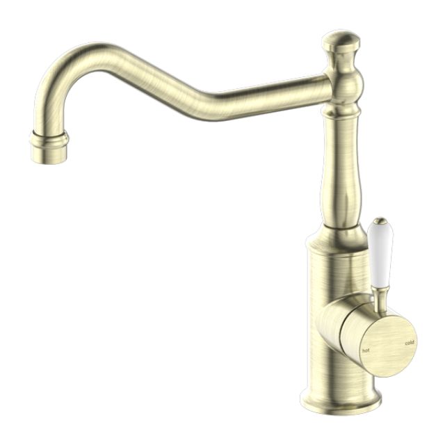 Nero York kitchen mixer tap in aged brass with hook spout and white porcelain lever, side view