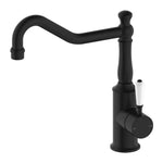 Nero York kitchen mixer tap in matte black with hook spout and white porcelain lever, side view on white background