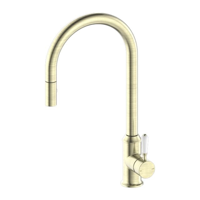 Nero York pull out sink mixer in aged brass with white porcelain lever, shown on white background