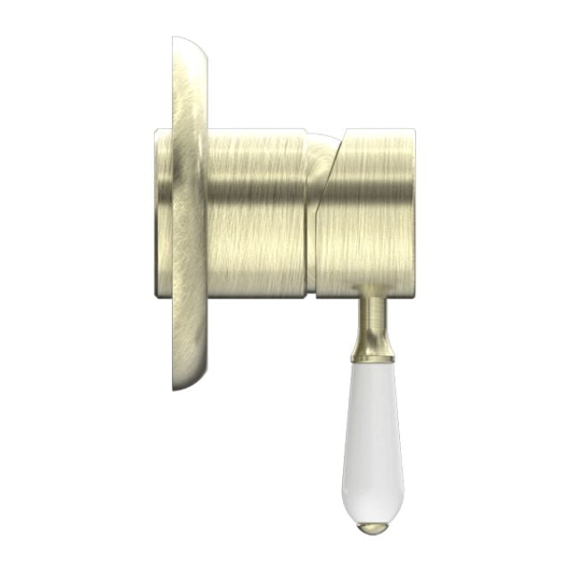 Nero York shower mixer in aged brass with white porcelain lever, side view, wall-mounted bathroom tap