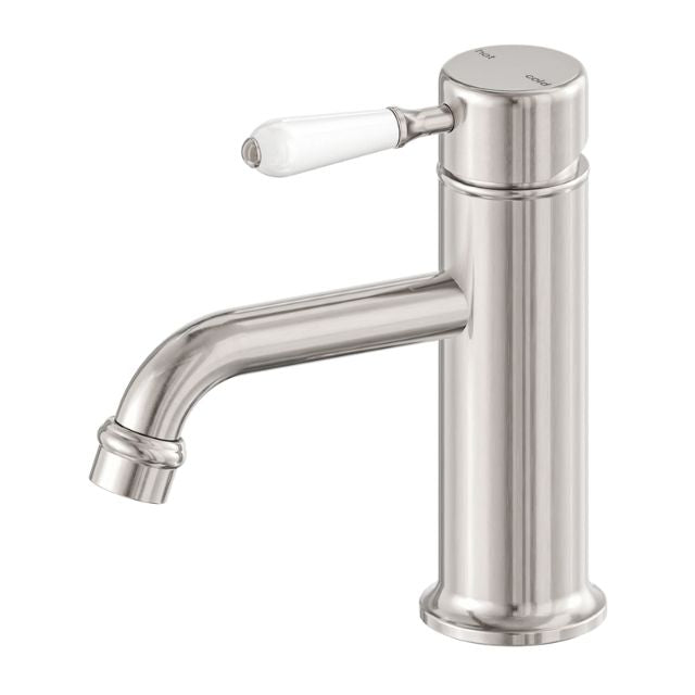 Nero York straight basin mixer in brushed nickel with white porcelain lever, single-hole tap view