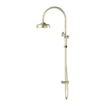 Nero York twin shower in aged brass, with overhead head and adjustable metal hand shower on rail, wall mounted.