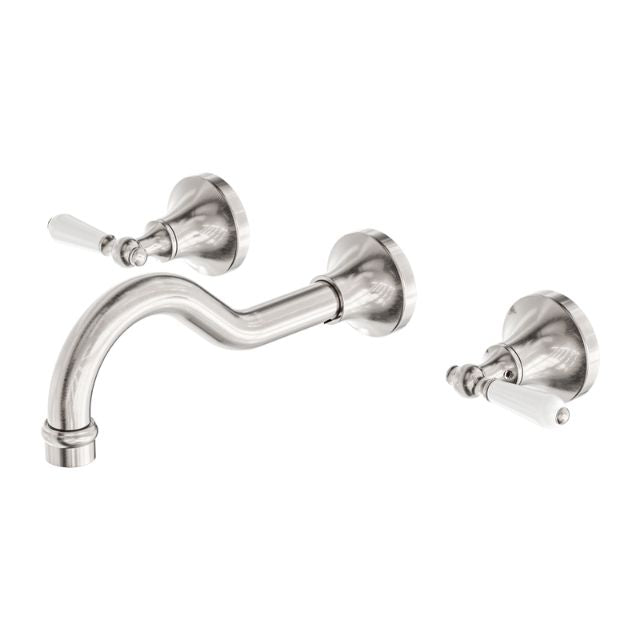 Nero York wall basin set in brushed nickel with white porcelain levers, shown on white background with spout and two wall taps