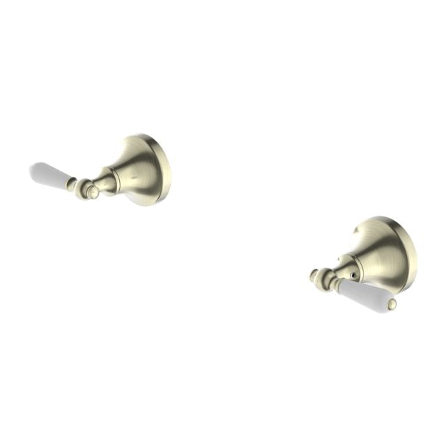 Nero York aged brass wall top taps with white porcelain lever handles, shown as a pair on white background
