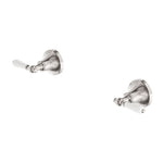 Nero York wall top assemblies in brushed nickel with white porcelain lever handles, shown in two angles on white background