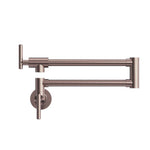 Nero Zen wall-mounted pot filler tap in brushed bronze, foldable dual-arm design with round wall plate, side view