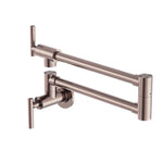 Nero Zen wall-mounted pot filler tap in brushed bronze, shown folded and extended on white background