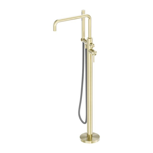 Nero Zen freestanding bath mixer in brushed gold with handheld shower hose, floor-mounted tap on round base panel