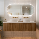 Timberline Ballad shaving cabinet with oval mirrored doors, warm timber finish and LED-lit bathroom vanity setting
