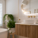 Phoenix Vivid Slimline Plus brushed gold wall top assemblies in a modern bathroom vanity setting