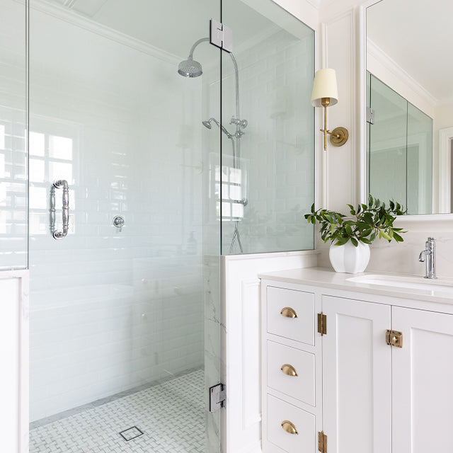 Phoenix Cromford twin shower in chrome, with overhead rose and handpiece in a bright white bathroom