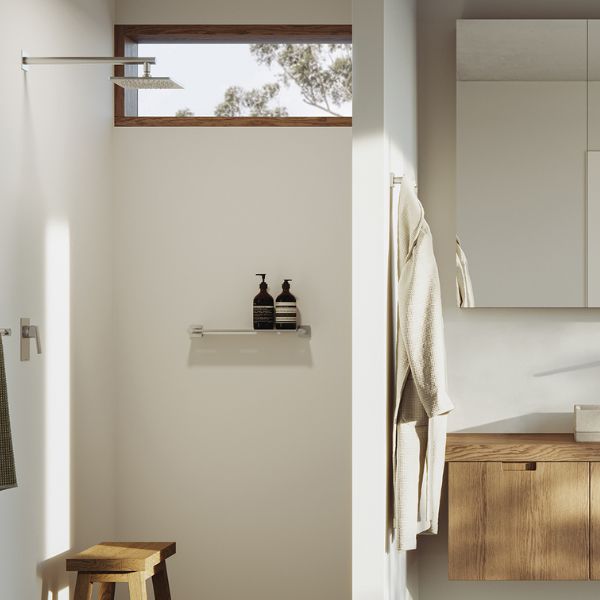 Phoenix Enviro316 brushed stainless steel shower mixer on a wall in a modern bathroom shower