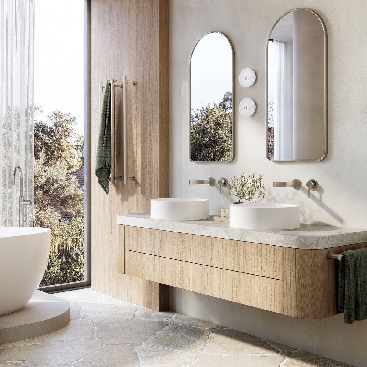 Brushed nickel wall basin mixer set with twin round handles in a modern bathroom vanity scene