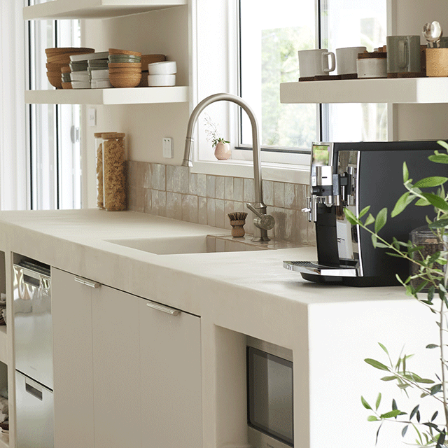 Phoenix Nostalgia pull out sink mixer in brushed nickel on a kitchen benchtop, showing the arched tap and sink area