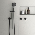 Phoenix NX IKO matte black rail shower with round handpiece and wall-mounted holder in a modern bathroom setting