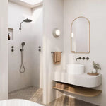 Phoenix Vivid Slimline Plus wall top assemblies in brushed carbon, wall-mounted beside a bathroom basin and mirror