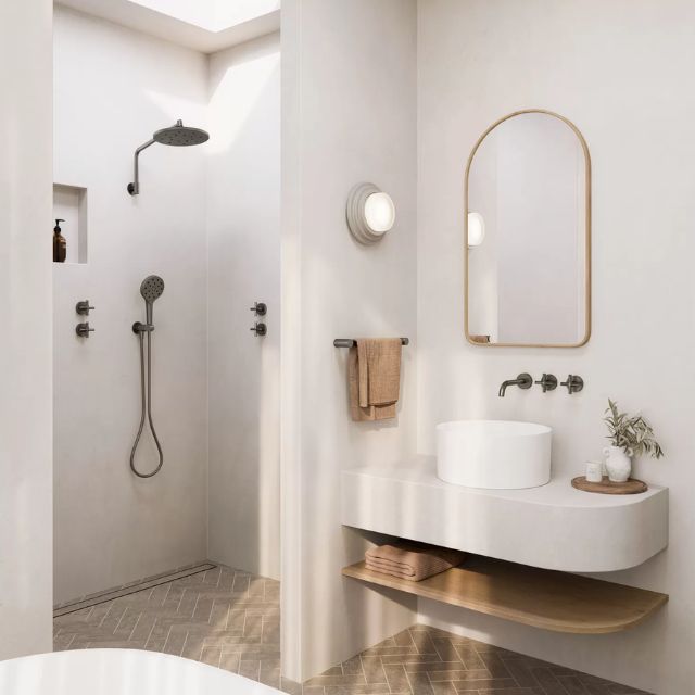 Phoenix Vivid Slimline Plus wall top assemblies in brushed carbon, wall-mounted beside a bathroom basin and mirror