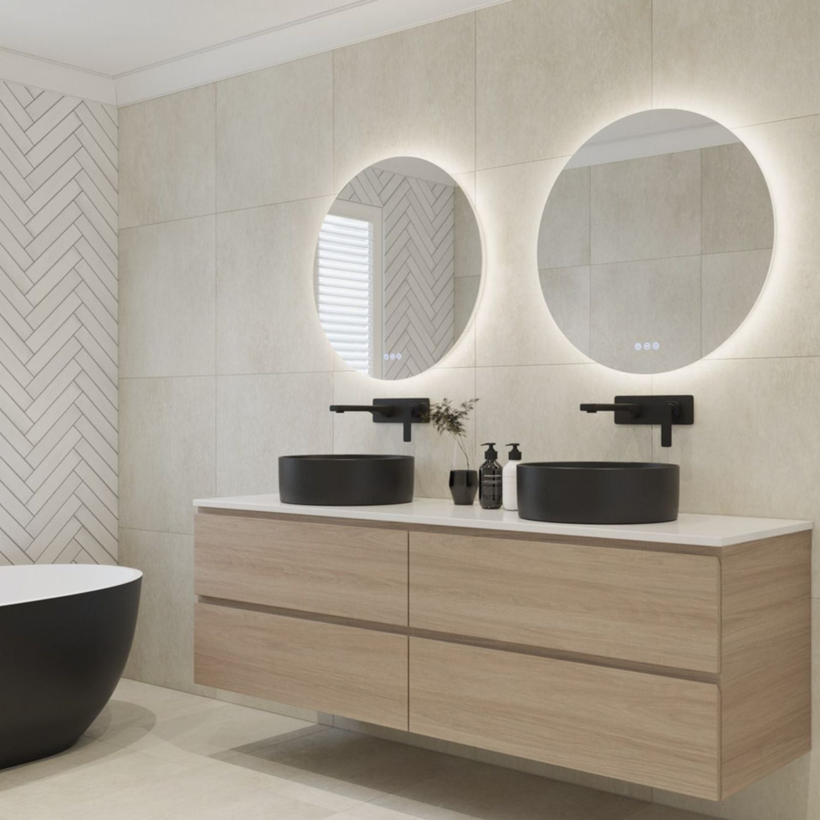 Radiant Olek frameless round LED mirror in a modern bathroom, shown above a double vanity with backlit glow