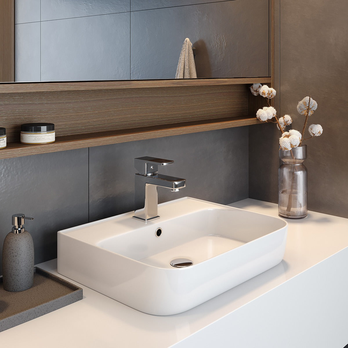 Raymor white rectangular above counter basin with wall-mounted mixer on a vanity top