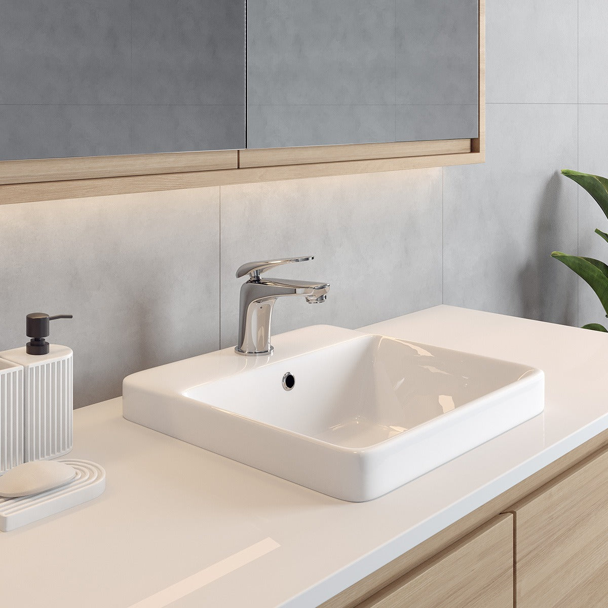 Raymor Edge II white rectangular inset basin with chrome mixer tap on a bathroom vanity counter